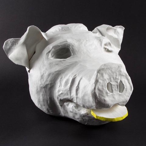 Schweinekopf mit Zitrone